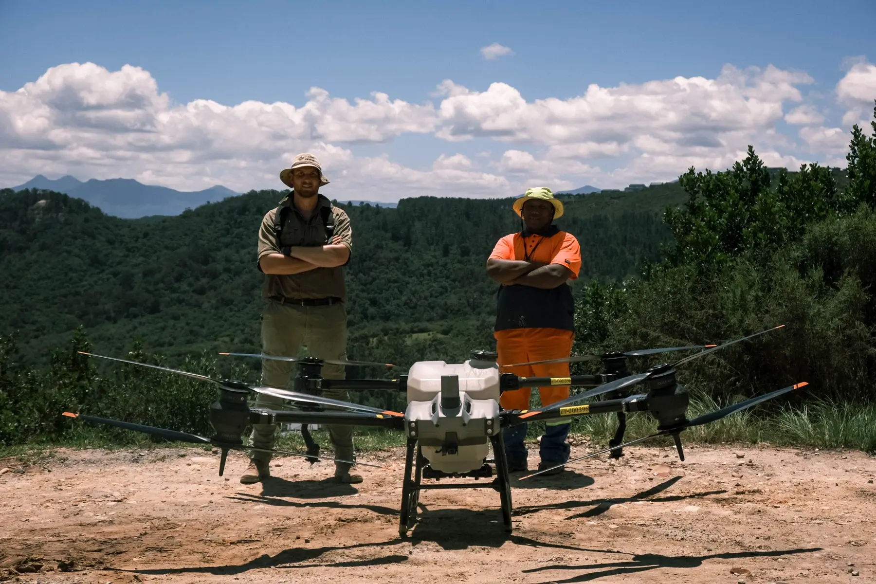 Earth Drones field team with a DJI Agras spray drone in the Southern Cape mountains